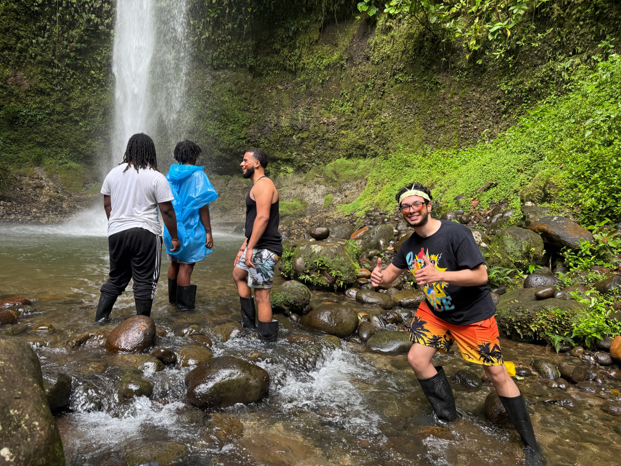Peace by Piece participants exploring a waterfall